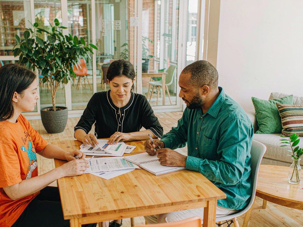 Buyer-side advisor reviewing property listings with clients