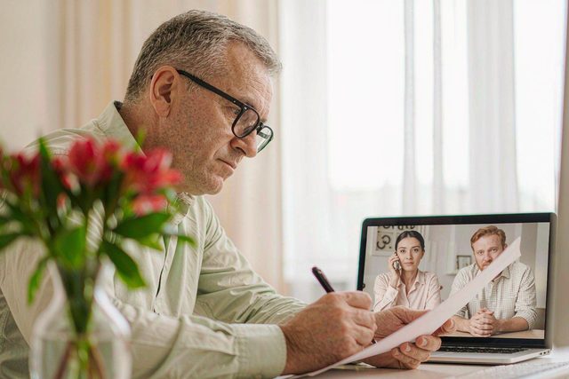 Advisor taking an enquiry brief on a video call